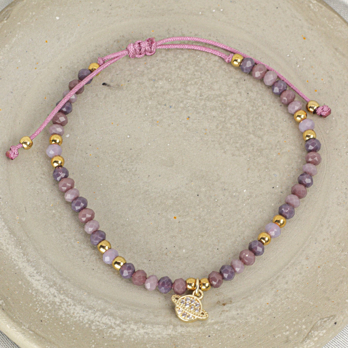 Pulsera Morada Saturno Zircones en Acero